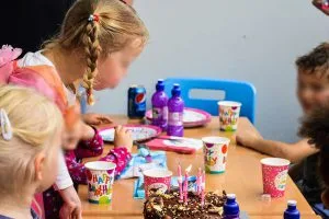 Families relaxing while children play